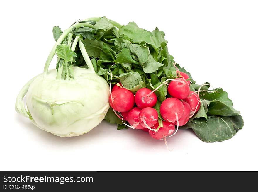 Fresh kohlrabi and radishes over a white background. Fresh kohlrabi and radishes over a white background