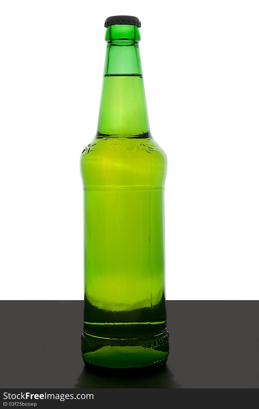 Green beer bottle with cap and no labels