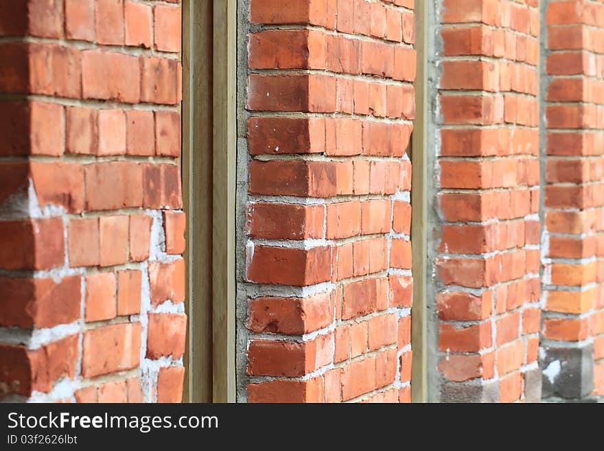 The red brick and white window