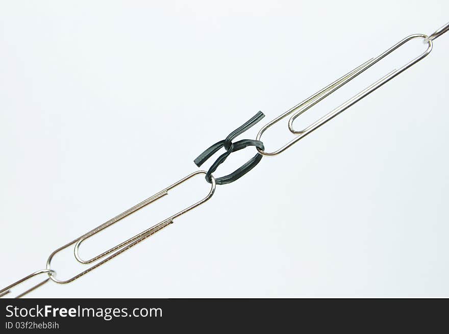 Photo of paper clips link by cable tie. Photo of paper clips link by cable tie