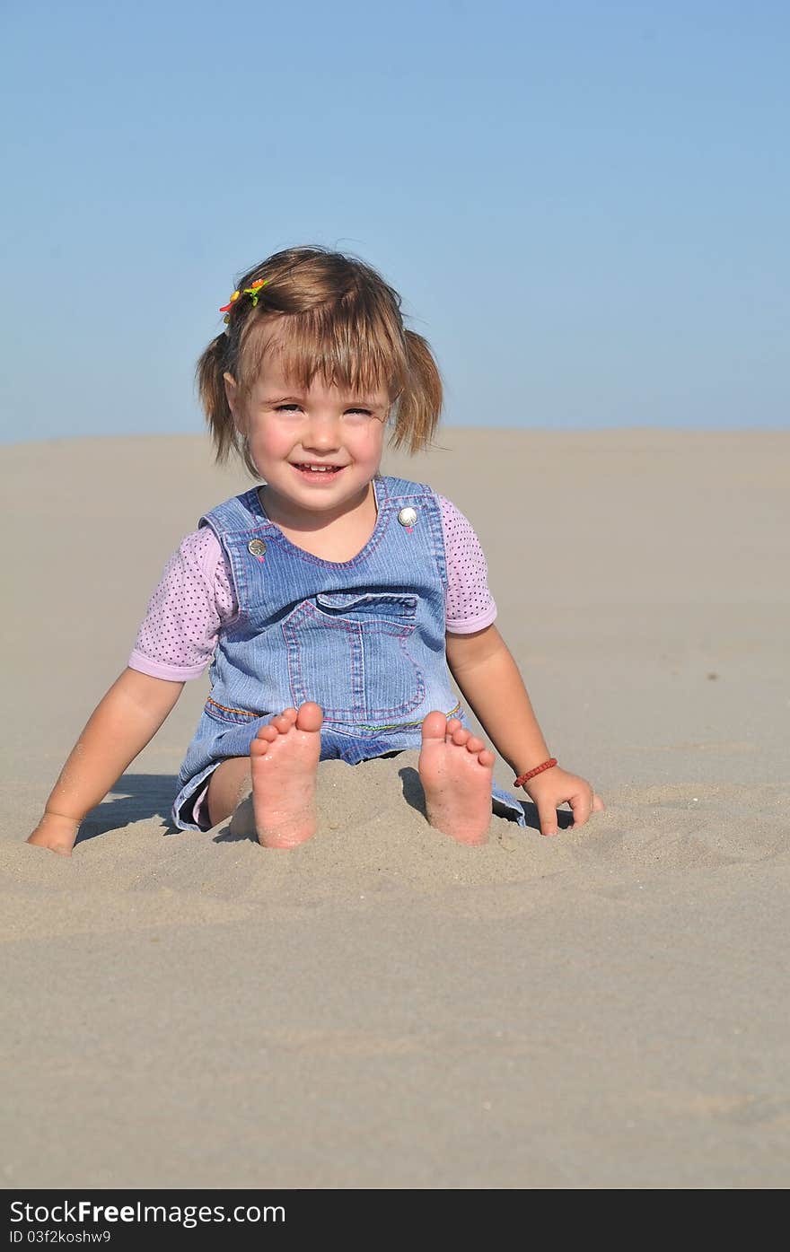 Cute little girl play in sand