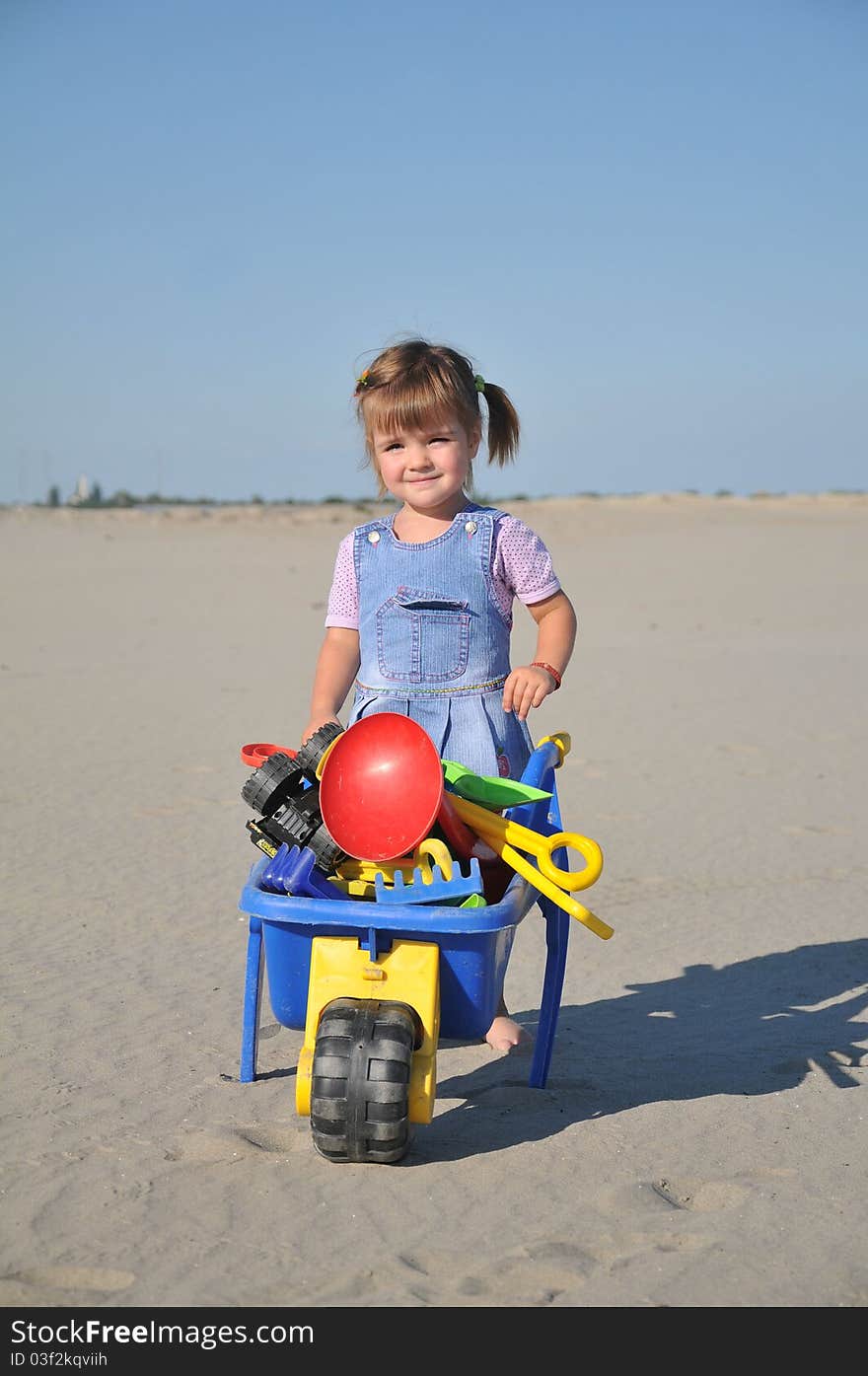 Cute little girl play in sand