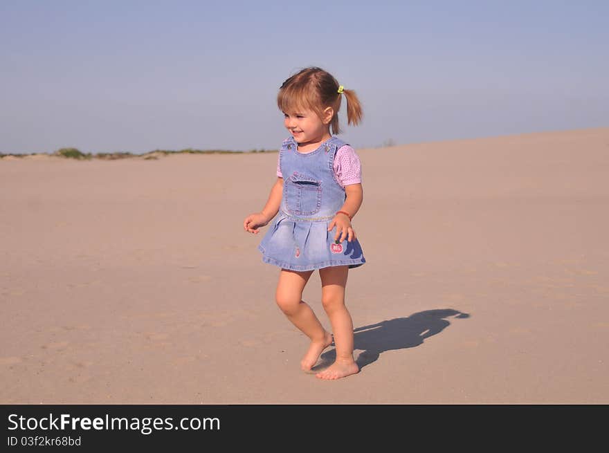 Cute little girl play in sand