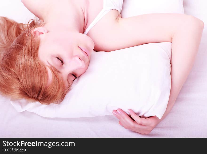 Portrait of young beautiful sleeping woman on bed at bedroom. Portrait of young beautiful sleeping woman on bed at bedroom