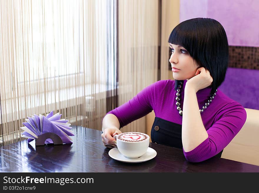 Young Woman In Cafe