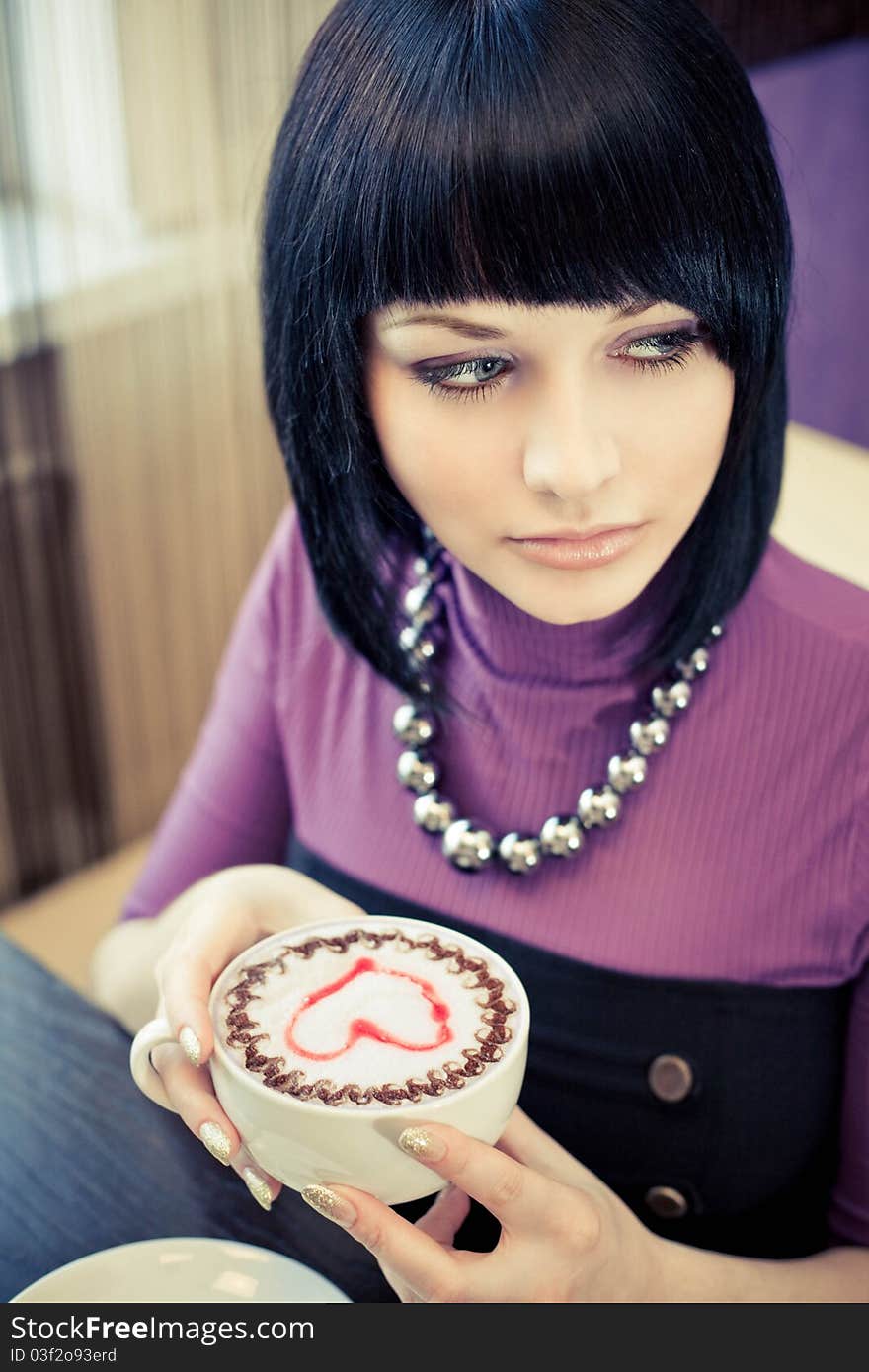 Young Woman In Cafe