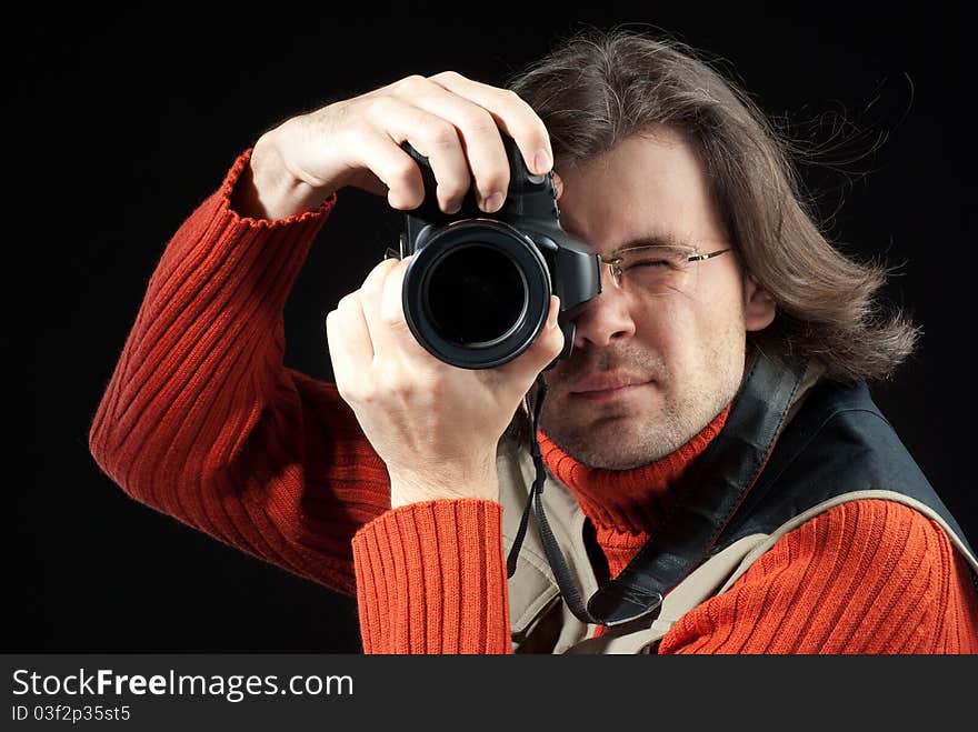 Long hair man with camera. Long hair man with camera