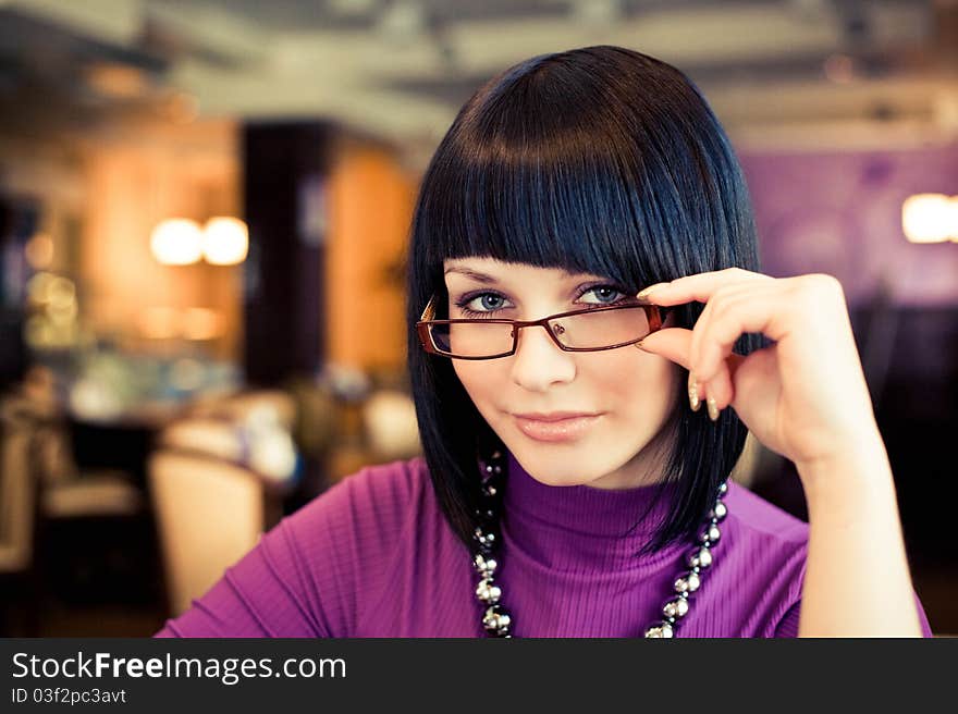 Portrait of attractive young woman with black hair