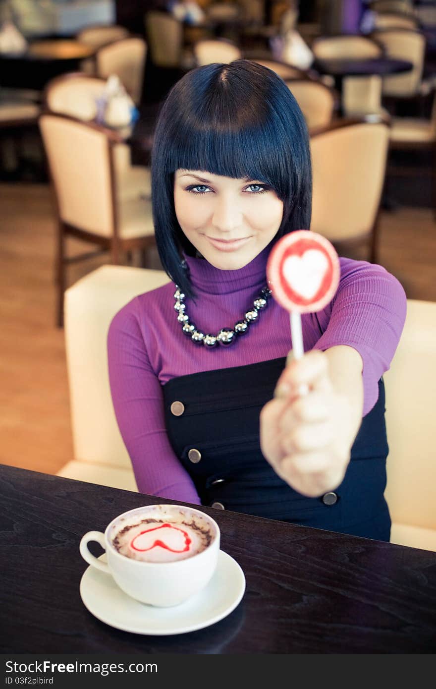 Young Woman In Cafe