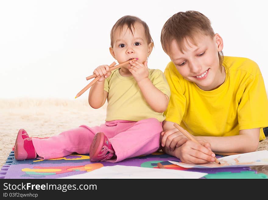 Brother and sister drawing and dreaming on white background