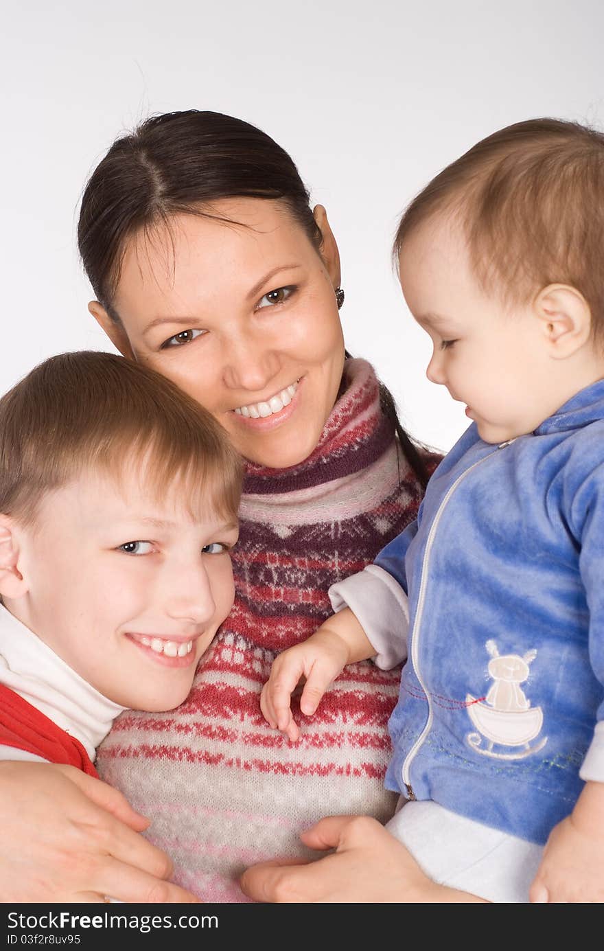 Happy mom with her children on white