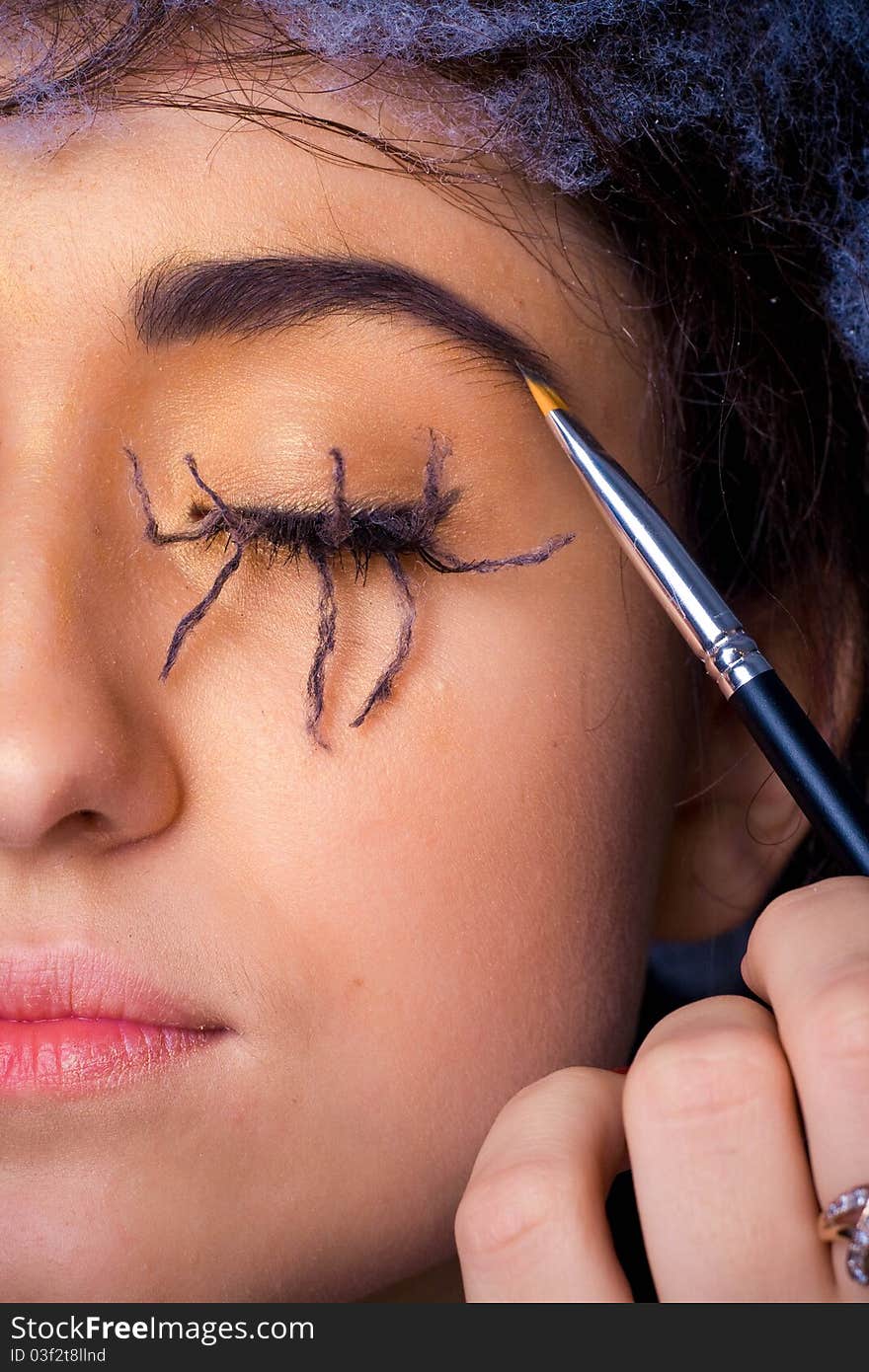 Woman with with lashes spider makeup