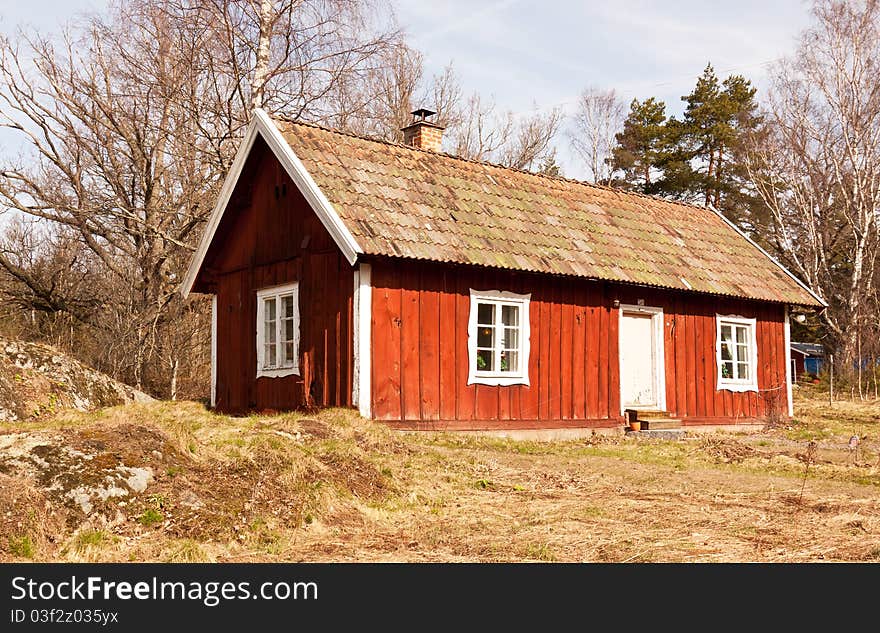 Typical old wooden, painted red and white, summer house in sweden. Typical old wooden, painted red and white, summer house in sweden.