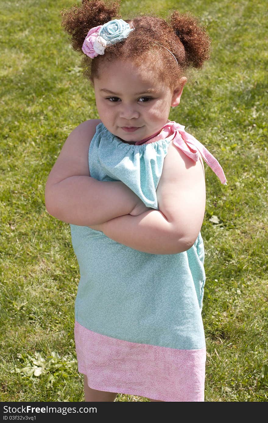 Young girl crossing her arms, acting very angry. Young girl crossing her arms, acting very angry.