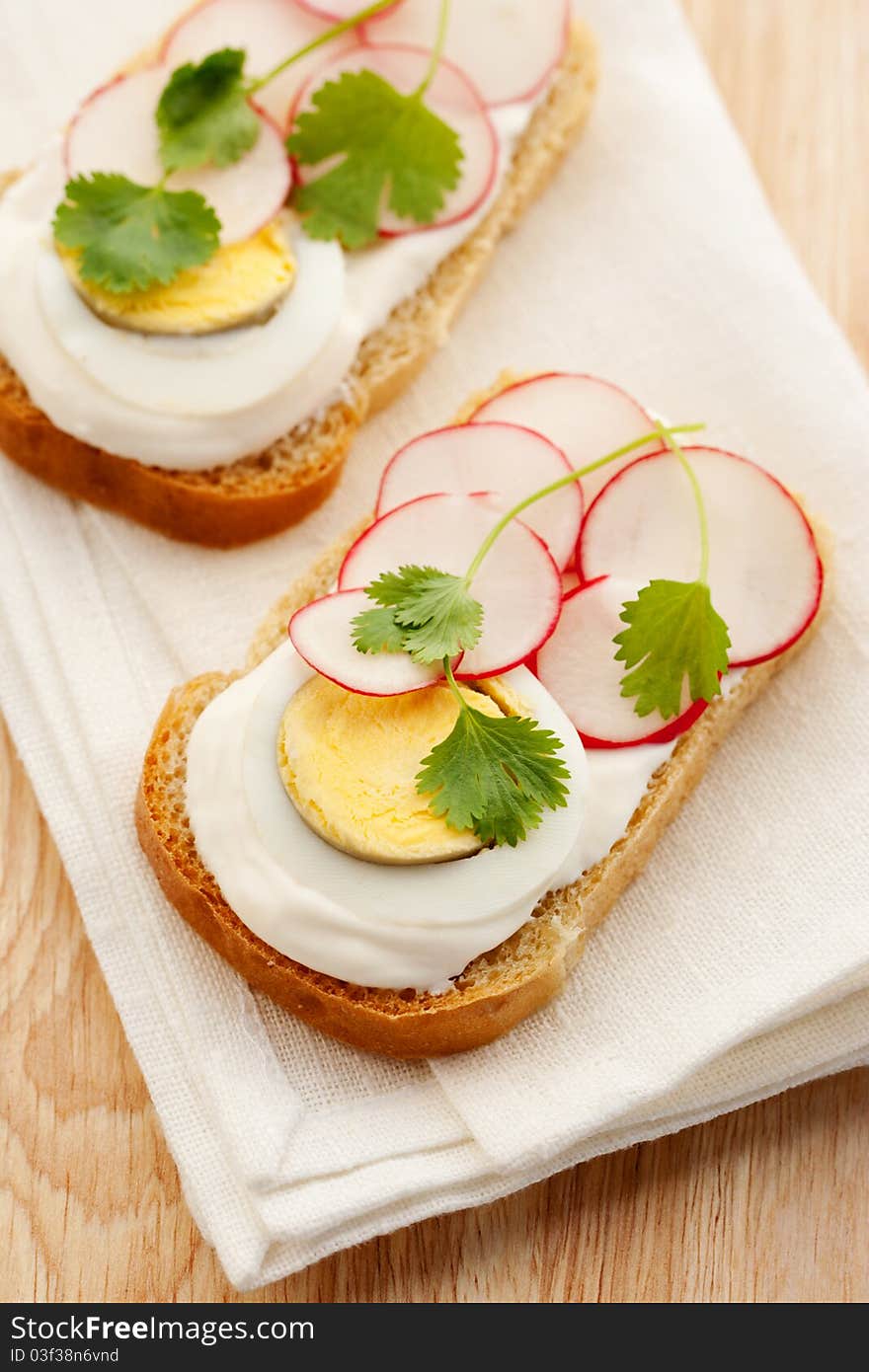 Healthy breakfast, sandwich with cream cheese, egg and radish