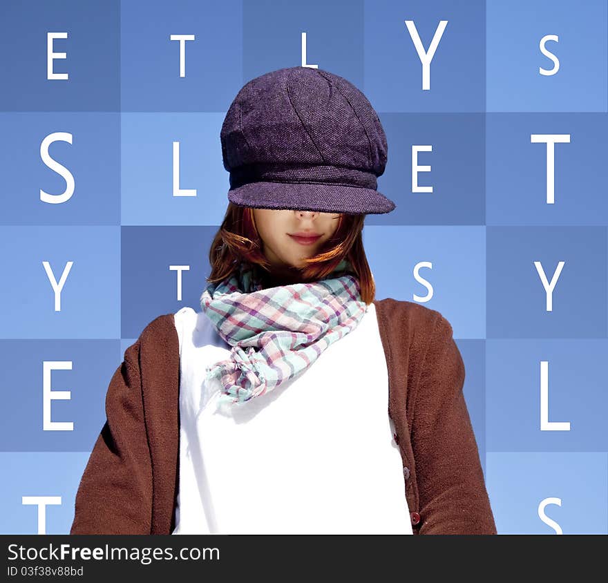 Portrait of red-haired girl with scarf and purple cap on blue background with words.