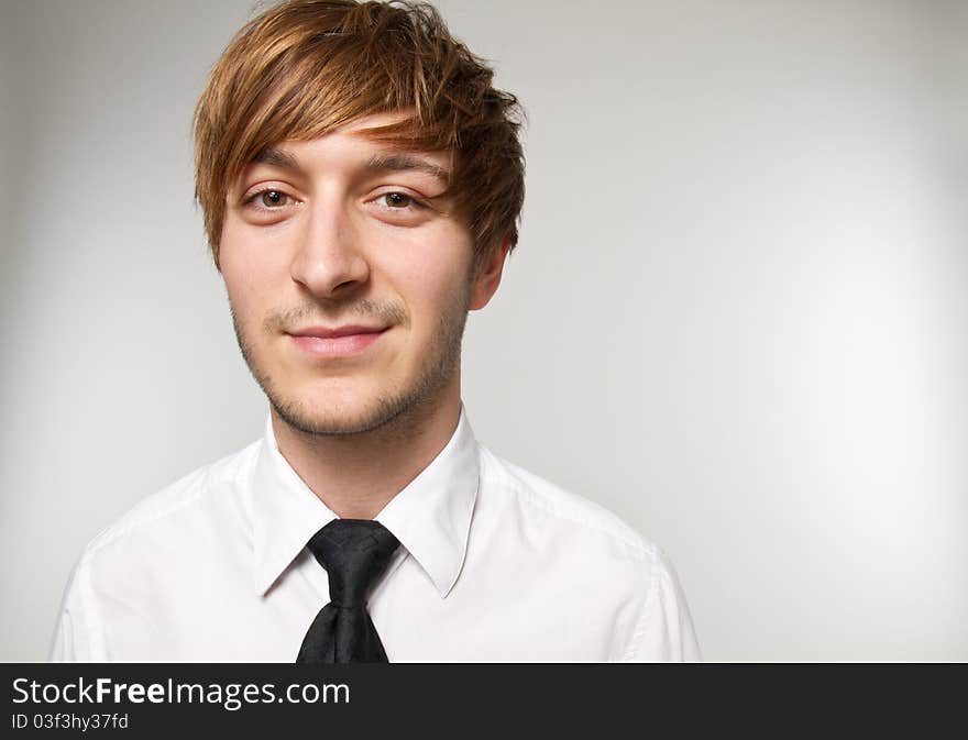 Young man is dressing up with tie. Young man is dressing up with tie