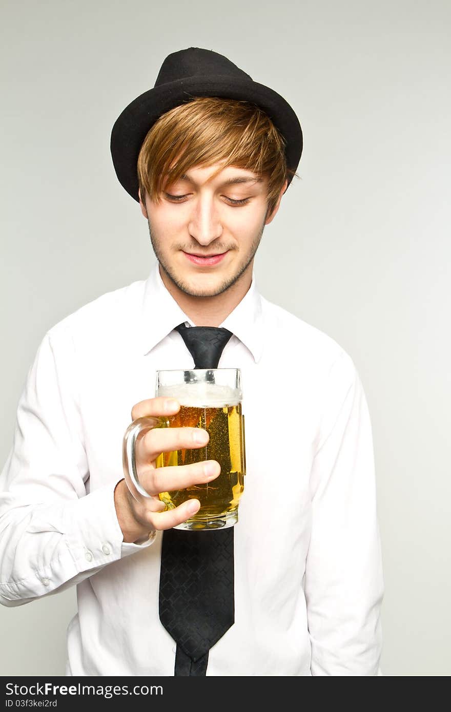 Young man with glass of beer