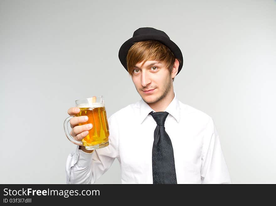 Young man with glass of beer