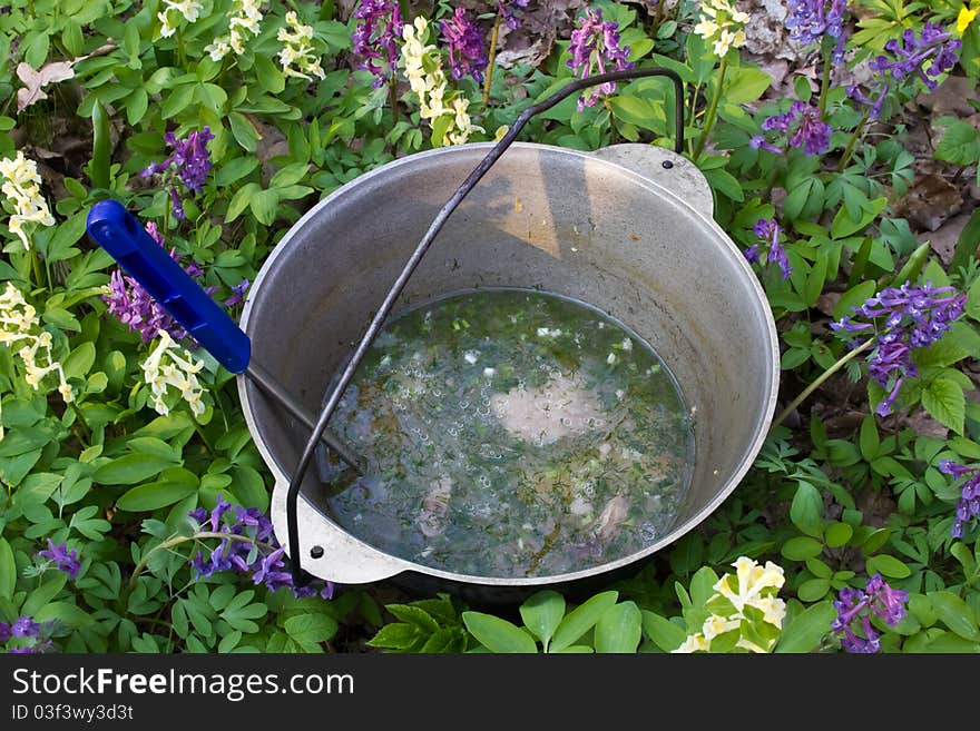 Preparing food on campfire