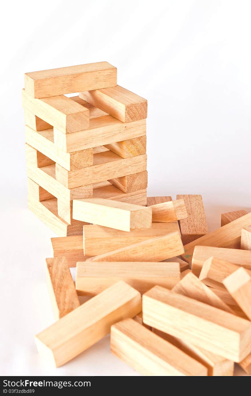 Stack of wooden rectangular blocks on white background