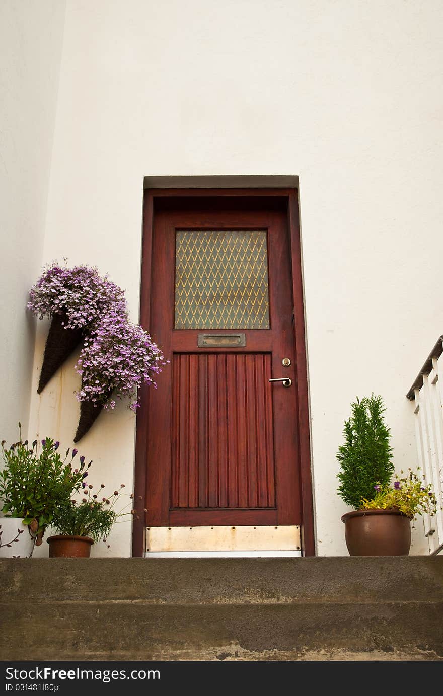 Wooden doors on the stair with flowers