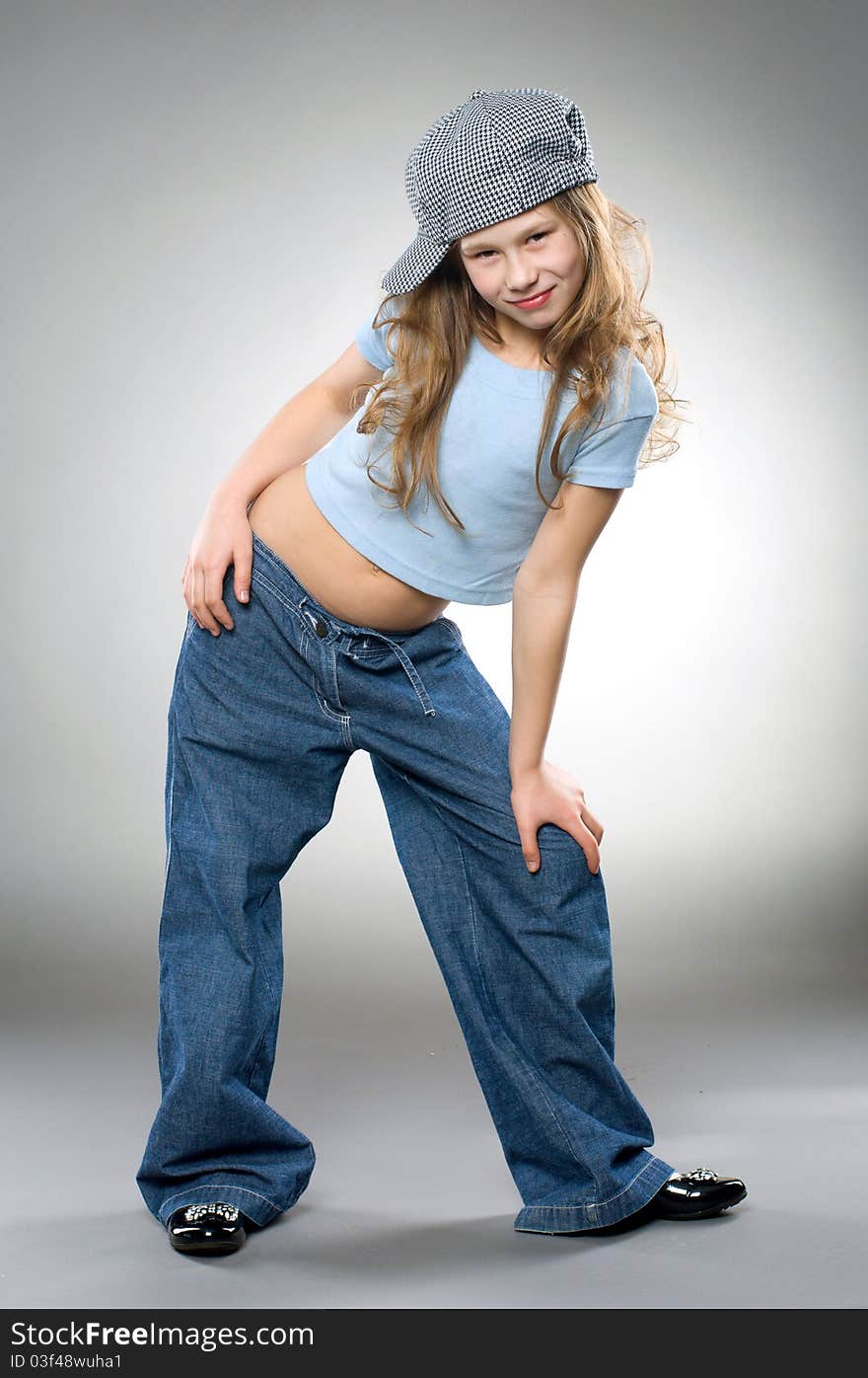 Dancing smiling girl, studio shot