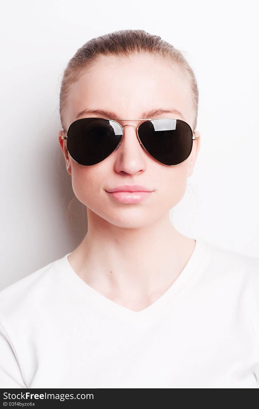 Glamorous young woman in sunglasses