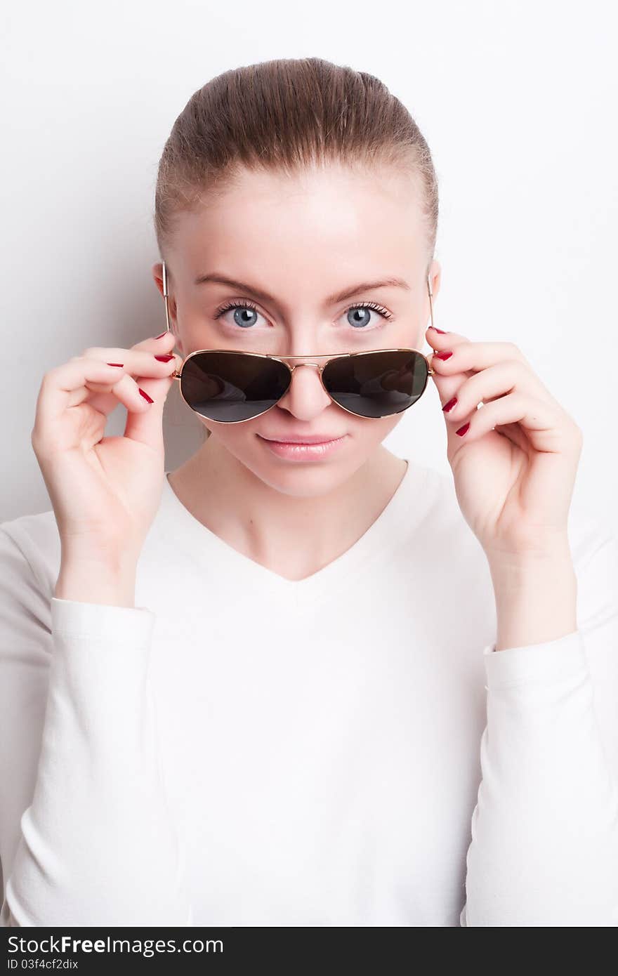 Glamorous young woman in sunglasses