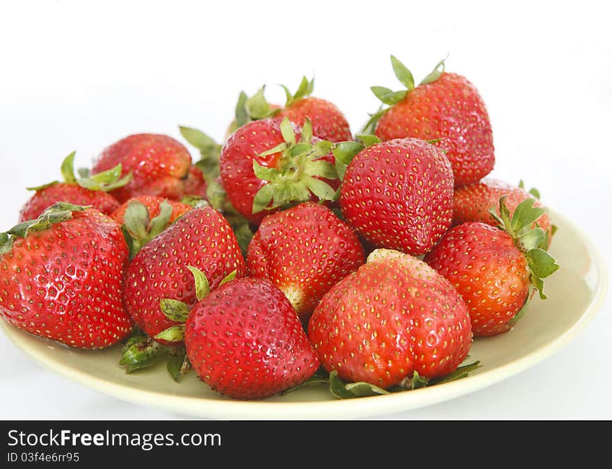 Pile of fresh strawberries on the plate