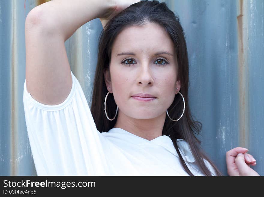 Young woman pushing her hand through her hair. Young woman pushing her hand through her hair.