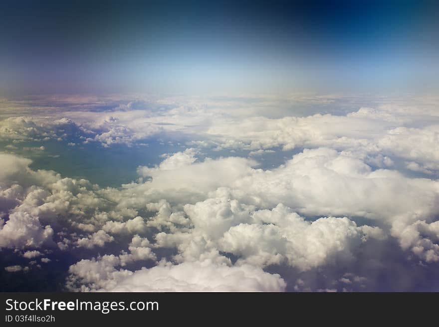 Kind on clouds on a background a firmament from an airplane