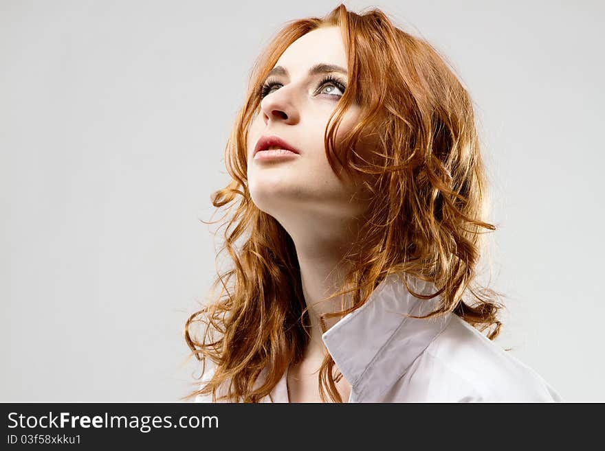 Portrait of a beautiful woman on gray background