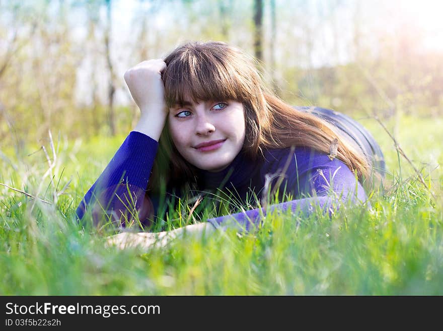 Young beautiful woman dreams at the park. Young beautiful woman dreams at the park