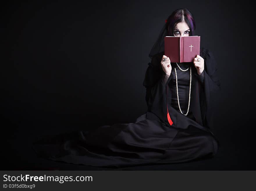 Gothic girl with the Bible