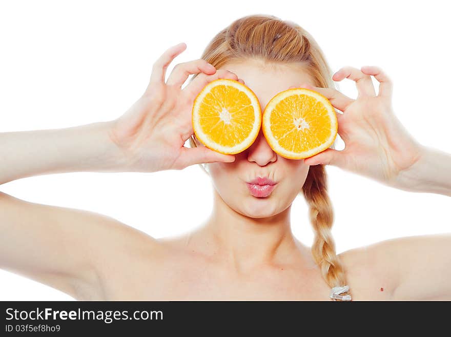 Young woman with oranges in her hands isolated on white