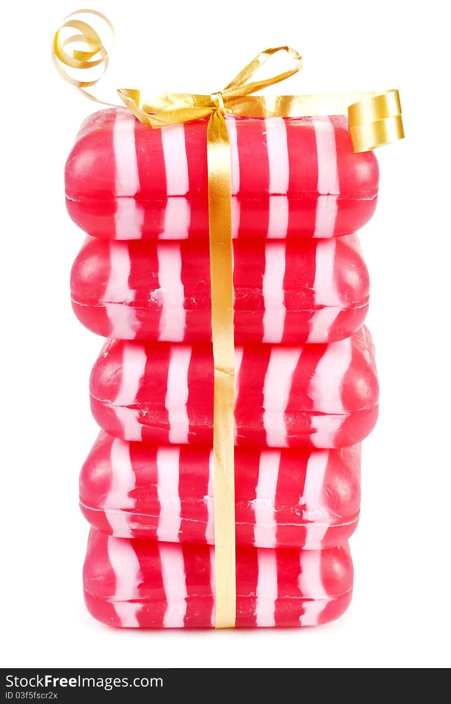 Stack of raspberry soaps on white background