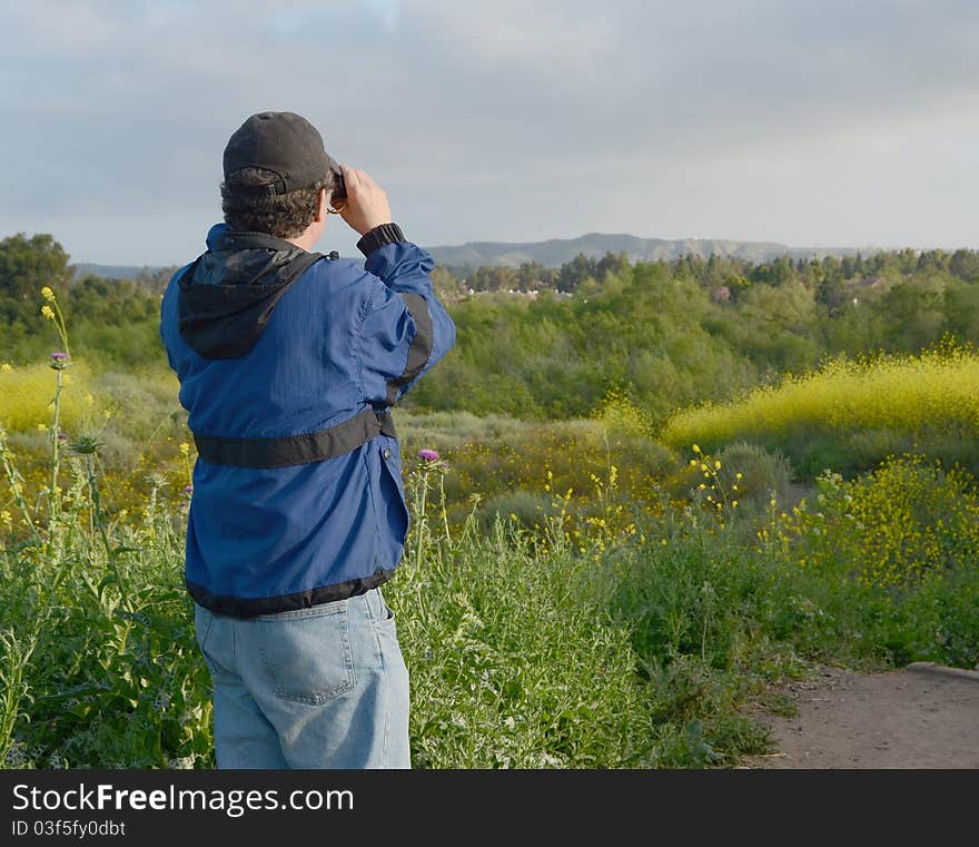 Man Looking Through Binoculars