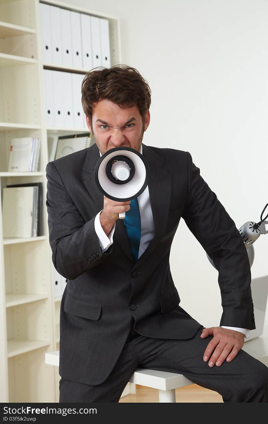 Business man in office with businessman megaphone