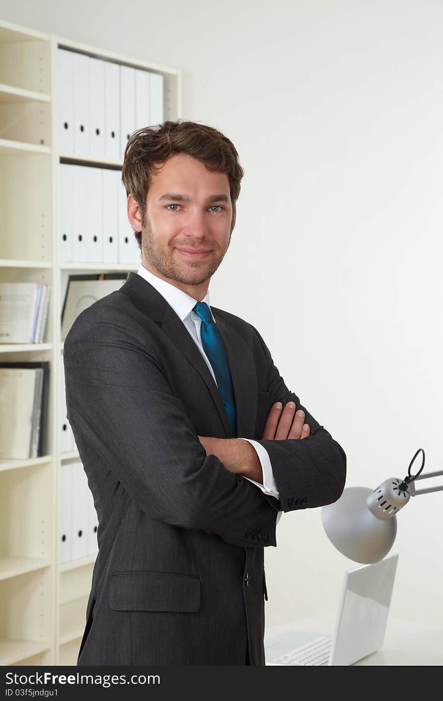 Businessman in office with laptop. Businessman in office with laptop