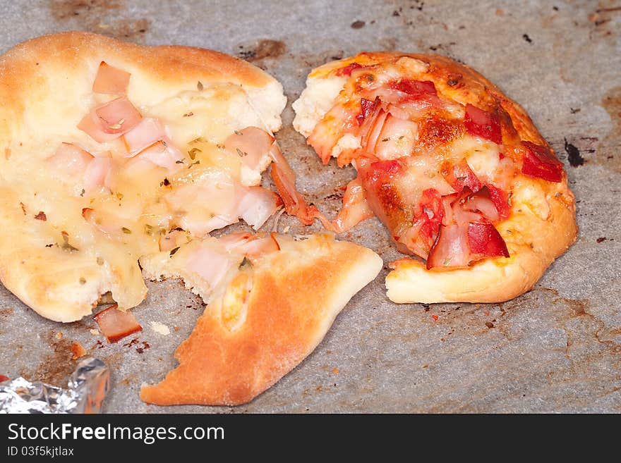 Mini pizza leftovers in a cardboard box. Mini pizza leftovers in a cardboard box