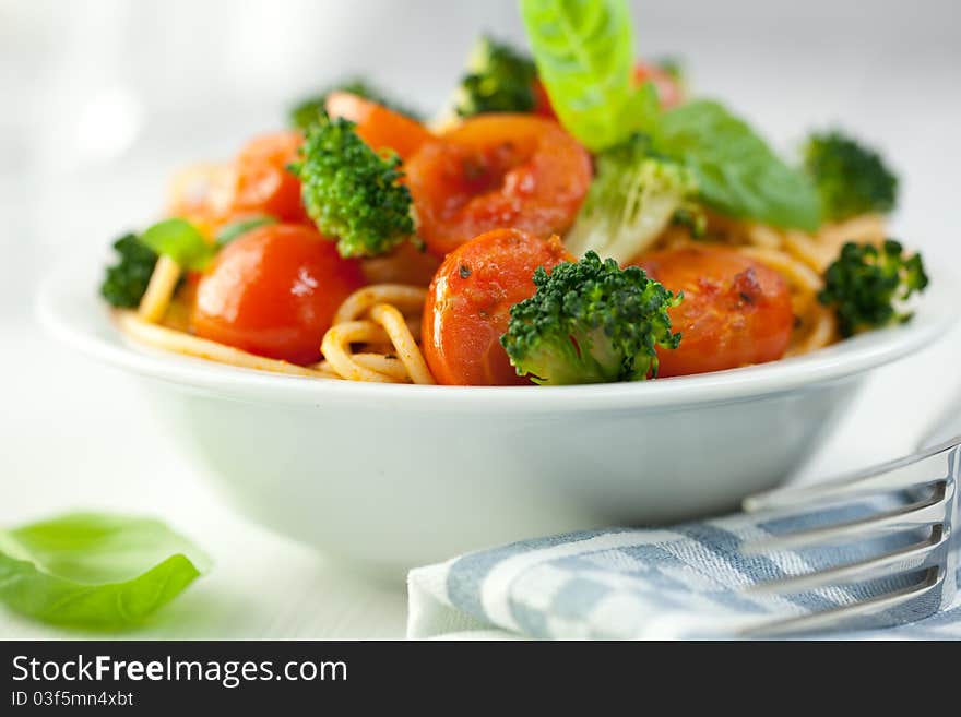 Spaghetti with vegetables flavoured with basil. Spaghetti with vegetables flavoured with basil