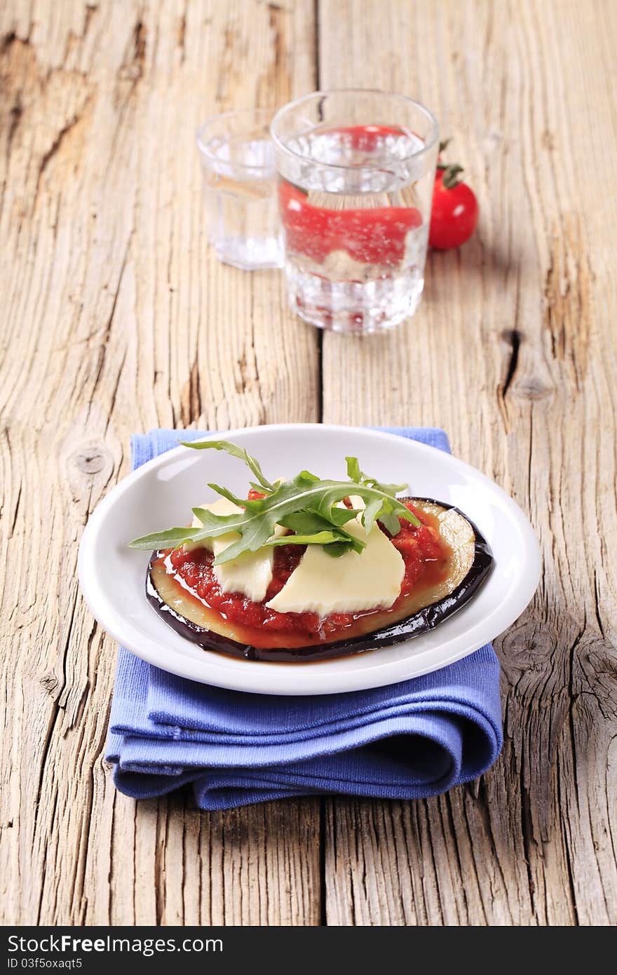 Baked eggplant with salsa and cheese. Baked eggplant with salsa and cheese