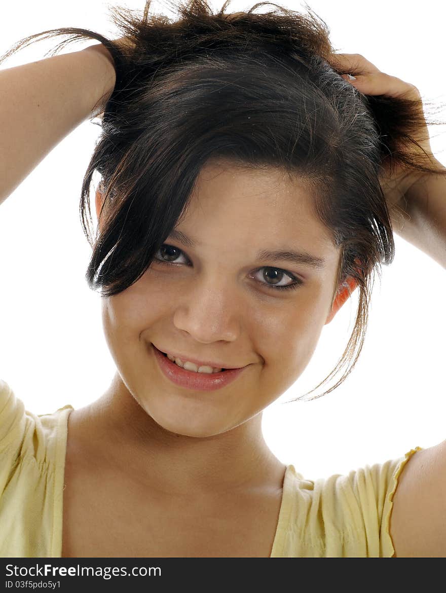 Closeup of a beautiful young teen lifting her hair up on top of her head. Closeup of a beautiful young teen lifting her hair up on top of her head.