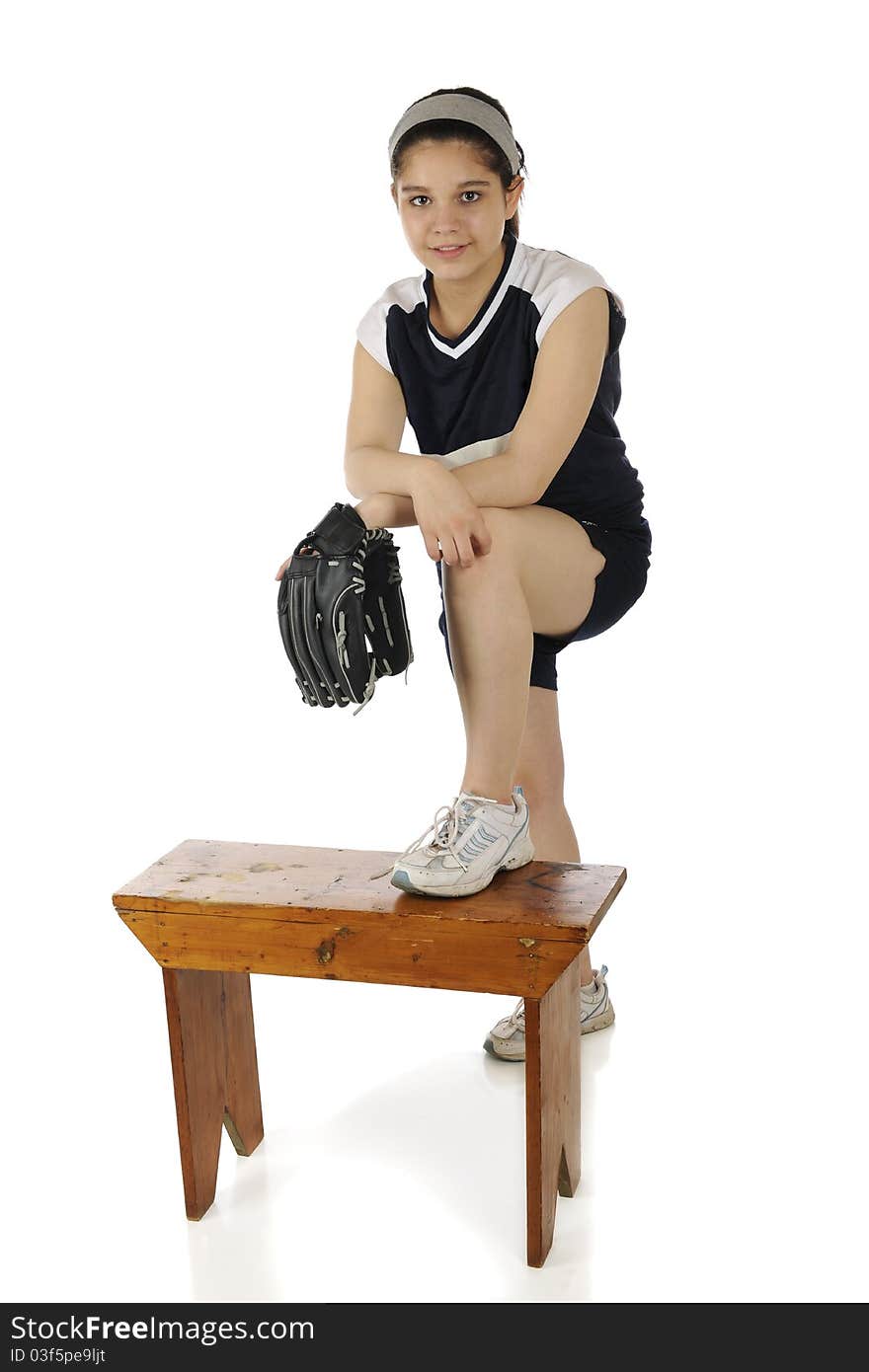 Portrait of a pretty young teen in her softball uniform. Isolated on white. Portrait of a pretty young teen in her softball uniform. Isolated on white.