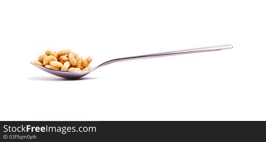 Round cornflakes in a spoon. Round cornflakes in a spoon