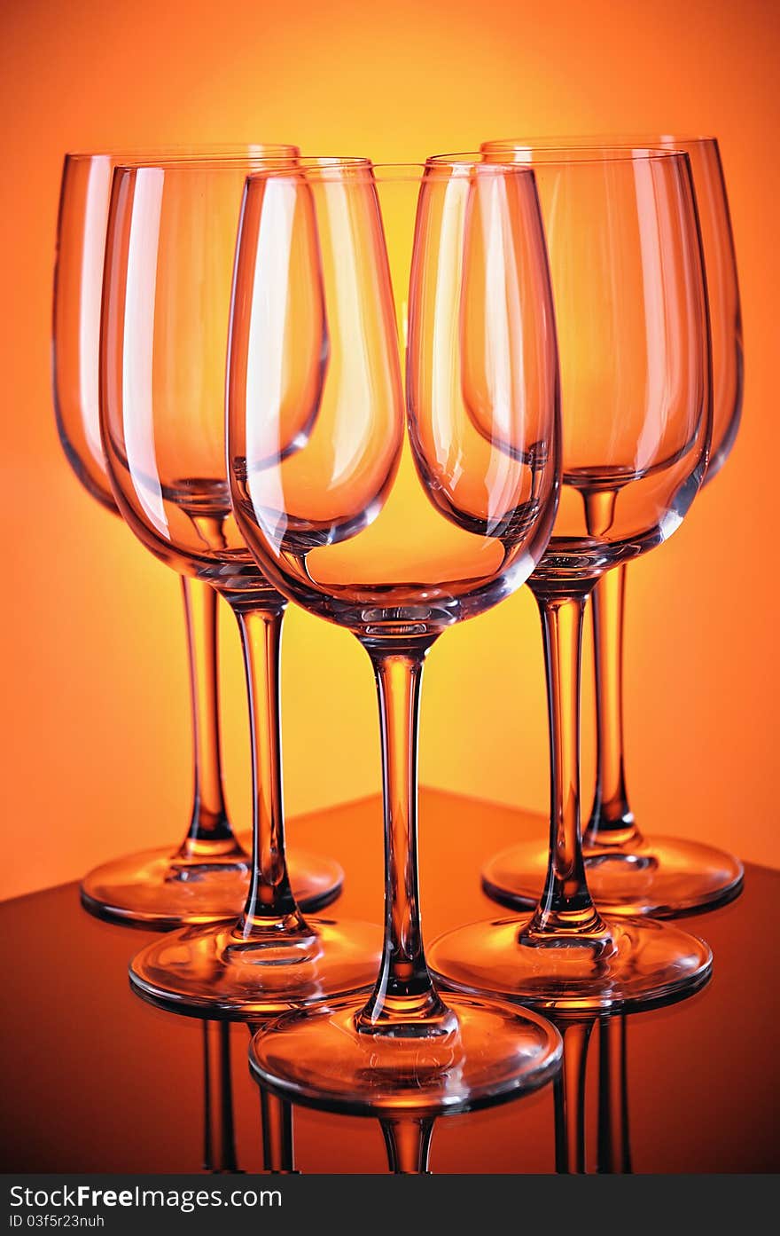 Group of wine glasses on colour a gradient a background