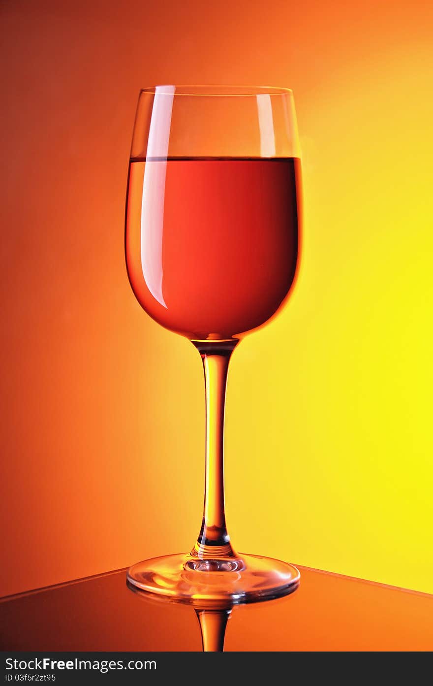 Wine glasses on colour a gradient a background