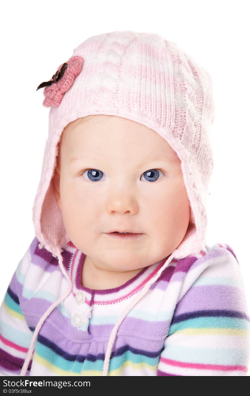 Portrait of cute happy baby girl in funny pink hat isolated on white background