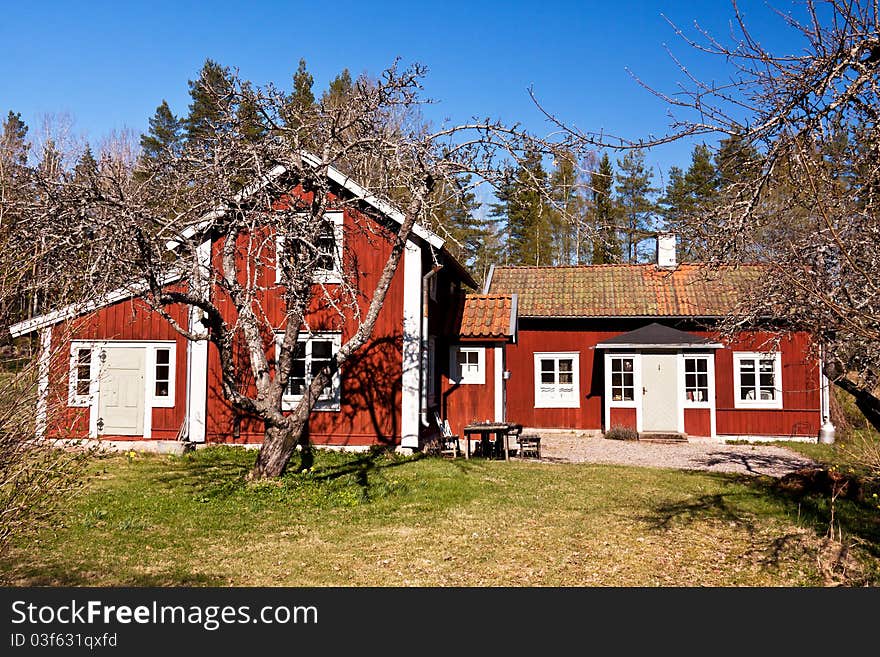 Idyllic Swedish rural house. typical old wooden, painted red and white. Idyllic Swedish rural house. typical old wooden, painted red and white.